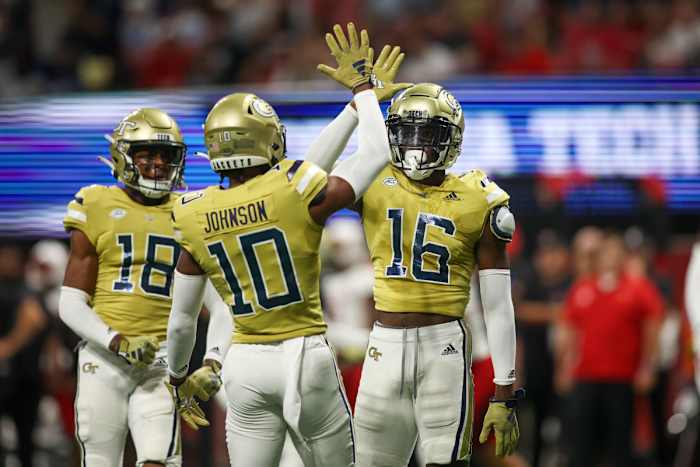 Sep 1, 2023; Atlanta, Georgia, USA; Georgia Tech Yellow Jackets defensive back K.J. Wallace (16) reacts after a pass breakup with defensive back Kenan Johnson (10) against the Louisville Cardinals in the first quarter at Mercedes-Benz Stadium. Mandatory Credit: Brett Davis-USA TODAY Sports